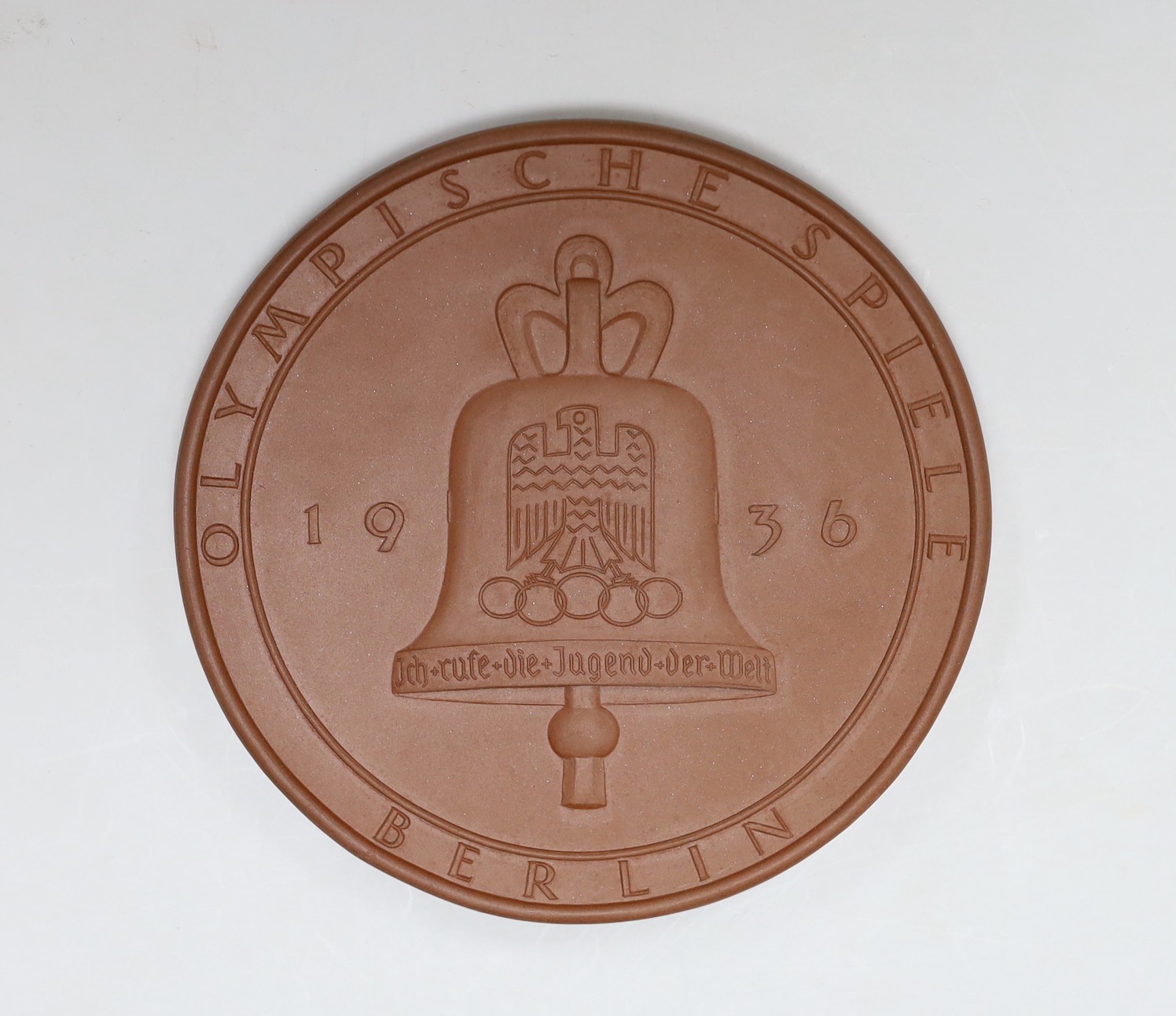 A cased Meissen Bottger stoneware 1936 Olympics Berlin commemorative medal. 12cm diameter